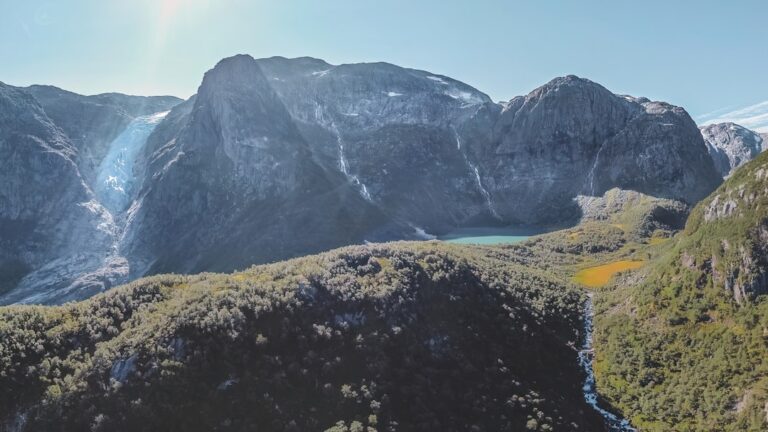 a view of a mountain range with a lake in the middle